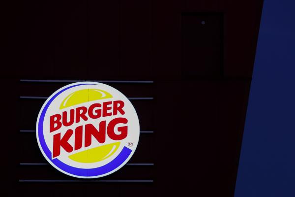 A sign for Burger King is displayed outside one of the company's restaurants in Paris